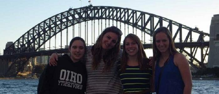 people in front of bridge